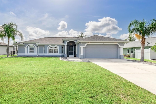 198 Porto Velho St, Punta Gorda, FL 33983 - view of front of property featuring a garage, stucco siding, concrete driveway, and a front yard
