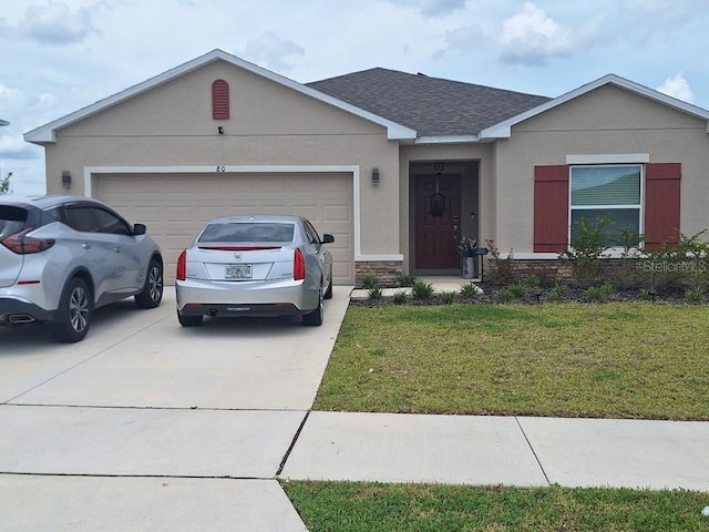 80 Citrine Loop, Kissimmee, FL 34758 - ranch-style house featuring driveway, an attached garage, a front lawn, stucco siding, and a shingled roof