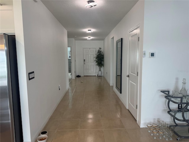80 Citrine Loop, Kissimmee, FL 34758 - corridor with light tile patterned floors and baseboards