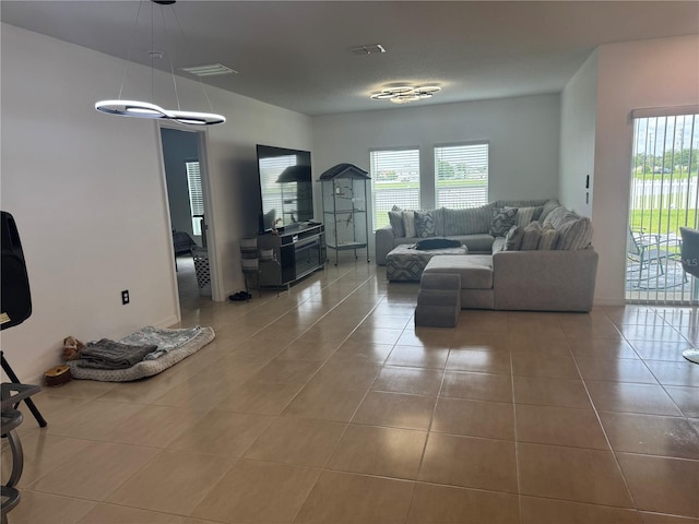 80 Citrine Loop, Kissimmee, FL 34758 - living room featuring tile patterned floors and healthy amount of natural light