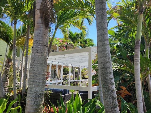 686 S Atlantic Ave Unit 1-8, Cocoa Beach, FL 32931 - rear view of property with a pergola