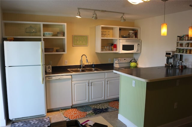 686 S Atlantic Ave Unit 1-8, Cocoa Beach, FL 32931 - kitchen featuring white appliances, open shelves, dark countertops, and decorative light fixtures