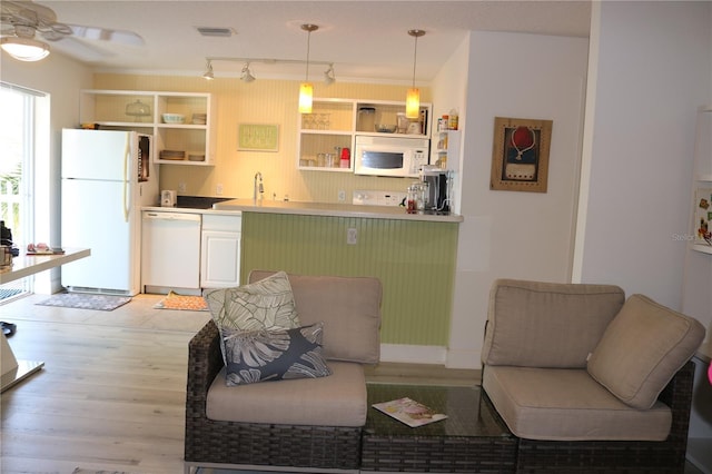 686 S Atlantic Ave Unit 1-8, Cocoa Beach, FL 32931 - living room featuring light wood-style flooring, a ceiling fan, and bar with sink