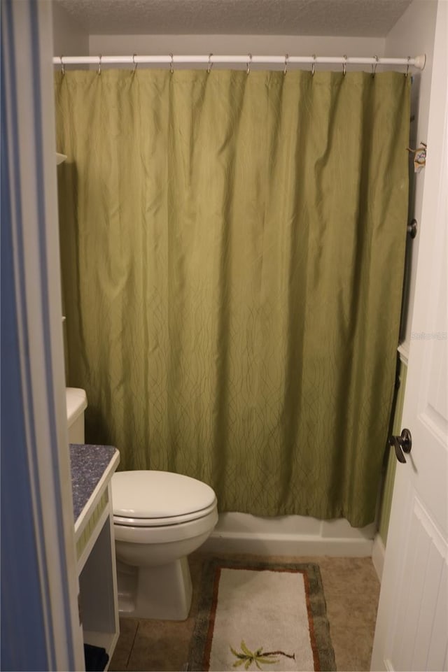 686 S Atlantic Ave Unit 1-8, Cocoa Beach, FL 32931 - full bathroom featuring vanity, tile patterned floors, and curtained shower