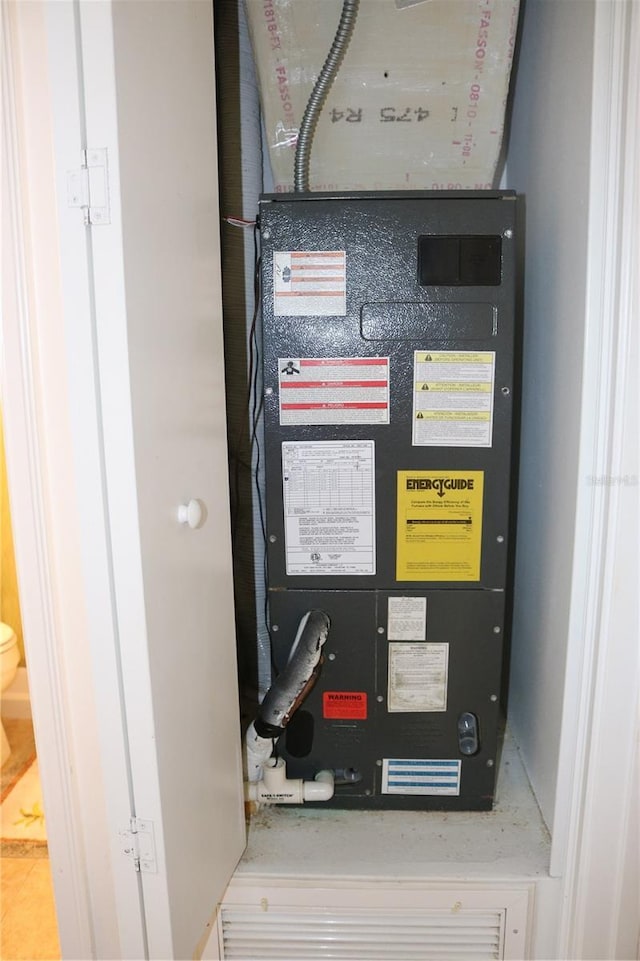 686 S Atlantic Ave Unit 1-8, Cocoa Beach, FL 32931 - utility room featuring heating unit