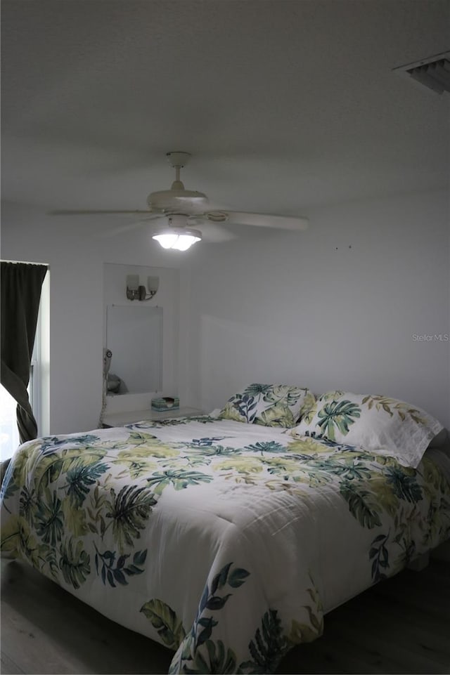 686 S Atlantic Ave Unit 1-8, Cocoa Beach, FL 32931 - bedroom with wood finished floors and a ceiling fan