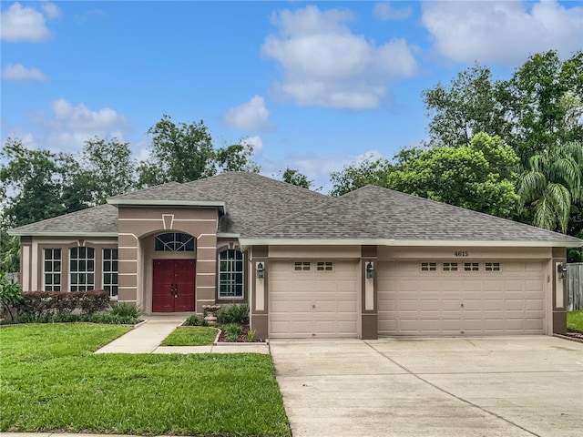 4615 River Overlook Dr, Valrico, FL 33596 - ranch-style home featuring a garage, a shingled roof, concrete driveway, and a front yard