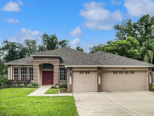 4615 River Overlook Dr, Valrico, FL 33596 - single story home featuring a garage, roof with shingles, concrete driveway, a front yard, and stucco siding