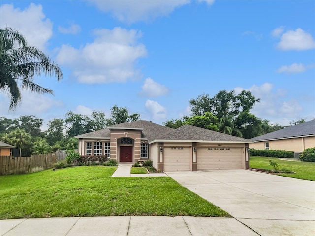 4615 River Overlook Dr, Valrico, FL 33596 - view of front of house featuring an attached garage, driveway, stucco siding, and roof with shingles