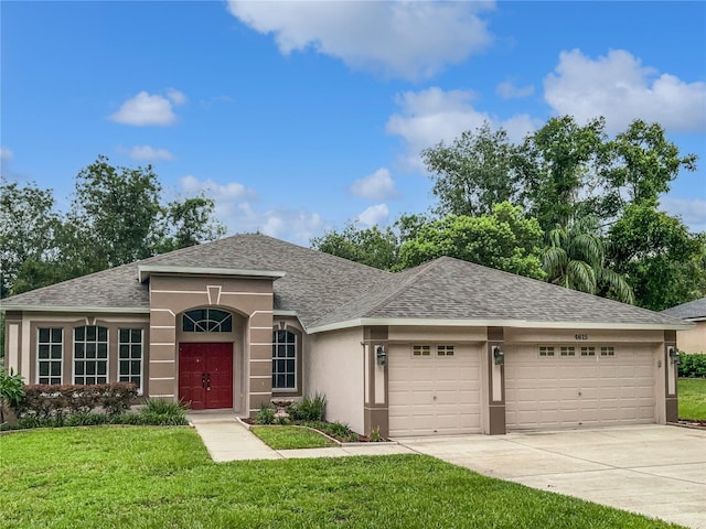 4615 River Overlook Dr, Valrico, FL 33596 - ranch-style home featuring a garage, stucco siding, a shingled roof, a front lawn, and concrete driveway