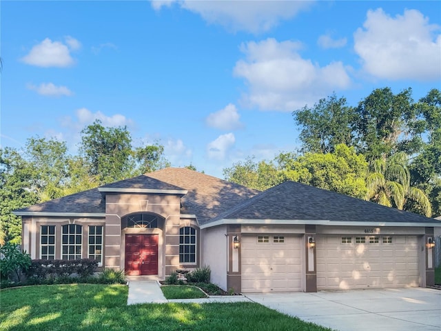 4615 River Overlook Dr, Valrico, FL 33596 - view of front facade with a garage, roof with shingles, concrete driveway, and stucco siding
