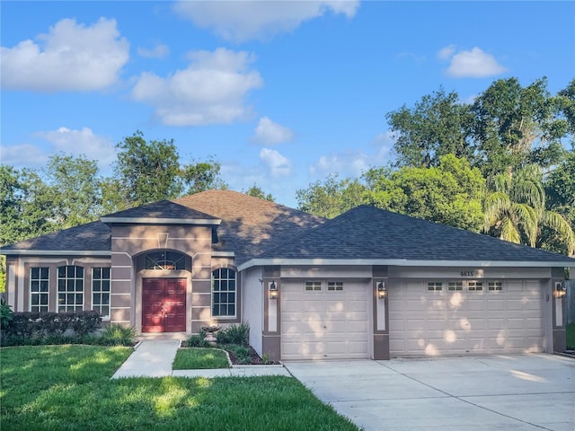 4615 River Overlook Dr, Valrico, FL 33596 - ranch-style home featuring a garage, concrete driveway, roof with shingles, a front yard, and stucco siding