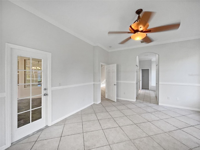 4615 River Overlook Dr, Valrico, FL 33596 - spare room featuring arched walkways, light tile patterned floors, a ceiling fan, and crown molding