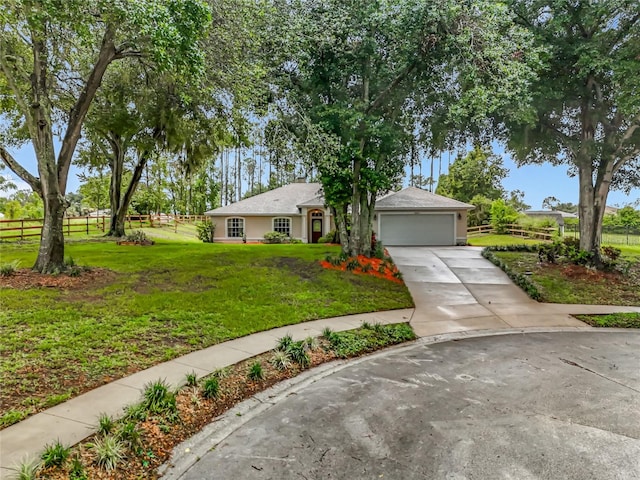16634 Pine Timber Ave, Montverde, FL 34756 - ranch-style house with concrete driveway