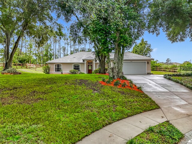 16634 Pine Timber Ave, Montverde, FL 34756 - single story home with stucco siding and concrete driveway