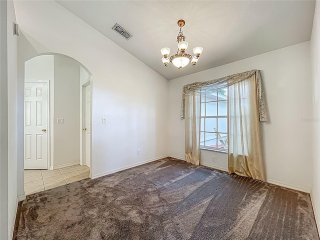 16634 Pine Timber Ave, Montverde, FL 34756 - empty room with carpet, arched walkways, a chandelier, vaulted ceiling, and tile patterned flooring