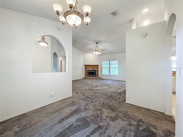 16634 Pine Timber Ave, Montverde, FL 34756 - unfurnished living room with carpet, ceiling fan, a brick fireplace, a chandelier, and vaulted ceiling