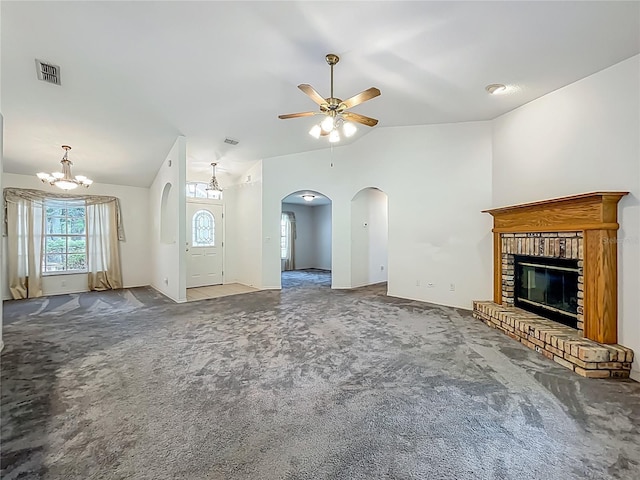 16634 Pine Timber Ave, Montverde, FL 34756 - unfurnished living room with carpet, a ceiling fan, arched walkways, lofted ceiling, and a fireplace