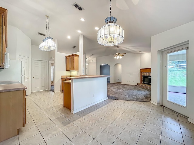 16634 Pine Timber Ave, Montverde, FL 34756 - kitchen with arched walkways, light tile patterned flooring, ceiling fan, lofted ceiling, and open floor plan