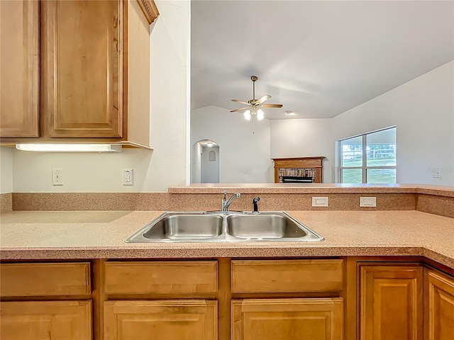 16634 Pine Timber Ave, Montverde, FL 34756 - kitchen featuring a ceiling fan, a fireplace, and light countertops