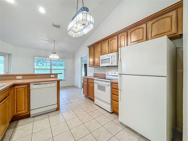 16634 Pine Timber Ave, Montverde, FL 34756 - kitchen with white appliances, a chandelier, lofted ceiling, healthy amount of natural light, and hanging light fixtures