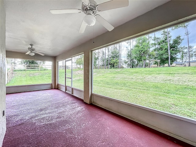 16634 Pine Timber Ave, Montverde, FL 34756 - unfurnished sunroom featuring a ceiling fan and plenty of natural light