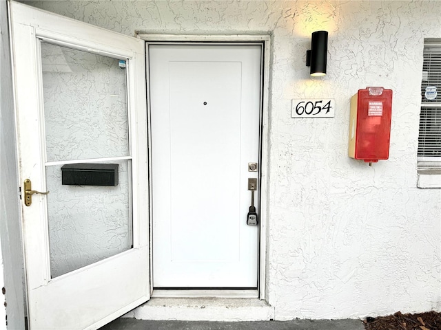 6054 Amberly Ct Unit T21, Orlando, FL 32822 - property entrance featuring stucco siding