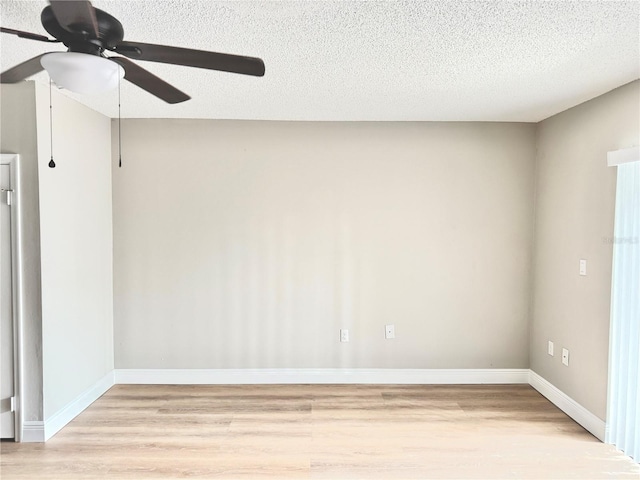 6054 Amberly Ct Unit T21, Orlando, FL 32822 - unfurnished room featuring a ceiling fan, light wood-type flooring, and a textured ceiling