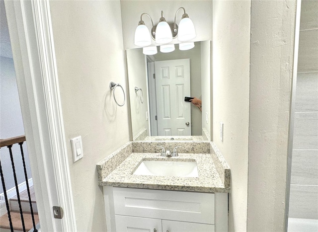 6054 Amberly Ct Unit T21, Orlando, FL 32822 - bathroom featuring a textured wall and vanity