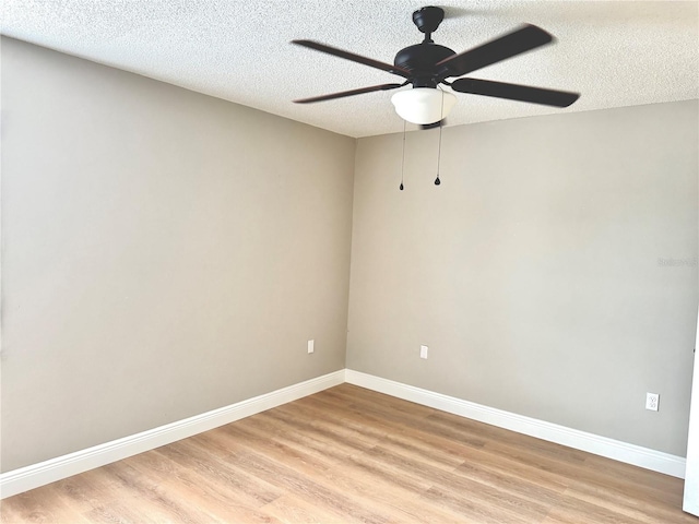 6054 Amberly Ct Unit T21, Orlando, FL 32822 - spare room featuring ceiling fan, light wood-type flooring, and a textured ceiling