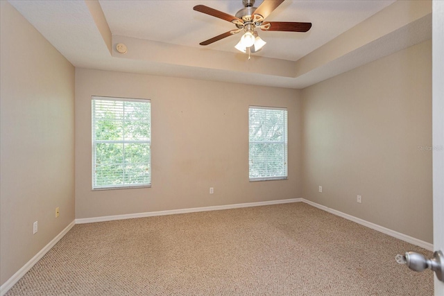 5072 Cypress Branch Pt, Oviedo, FL 32765 - carpeted spare room with a tray ceiling, ceiling fan, and a smoke detector