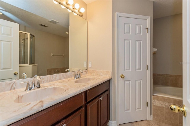 5072 Cypress Branch Pt, Oviedo, FL 32765 - bathroom with double vanity, a bath, and tile patterned floors