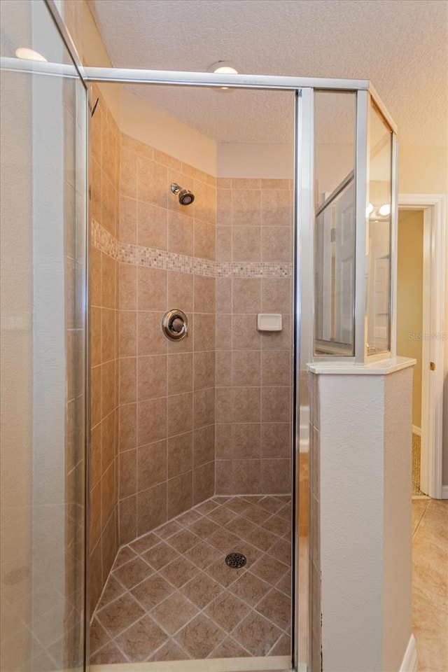 5072 Cypress Branch Pt, Oviedo, FL 32765 - bathroom with a stall shower and a textured ceiling