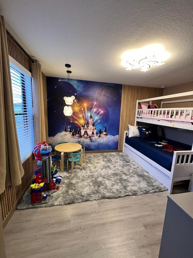 3292 Tranquil Trl, Kissimmee, FL 34747 - bedroom with wood finished floors and a textured ceiling