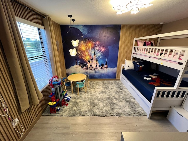 3292 Tranquil Trl, Kissimmee, FL 34747 - bedroom featuring a chandelier and wood finished floors