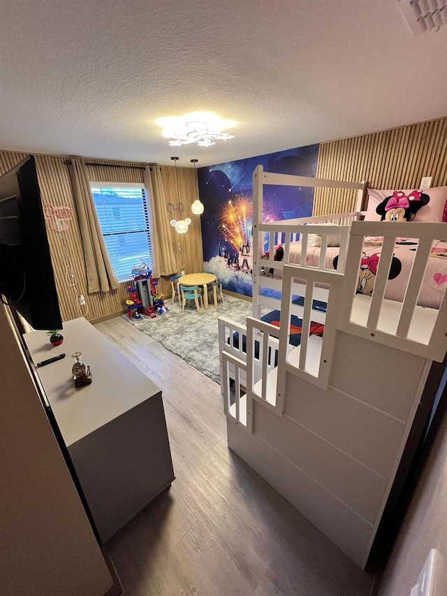 3292 Tranquil Trl, Kissimmee, FL 34747 - bedroom with wood finished floors and a textured ceiling