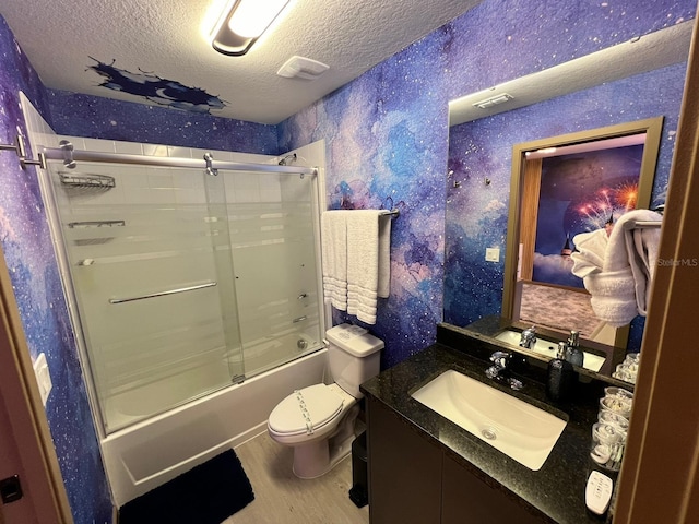 3292 Tranquil Trl, Kissimmee, FL 34747 - bathroom featuring a textured ceiling, wallpapered walls, enclosed tub / shower combo, vanity, and wood finished floors