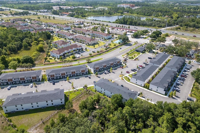 3292 Tranquil Trl, Kissimmee, FL 34747 - aerial view of property and surrounding area featuring a nearby body of water and nearby suburban area