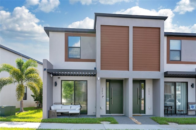 3292 Tranquil Trl, Kissimmee, FL 34747 - view of front facade with stucco siding and outdoor lounge area