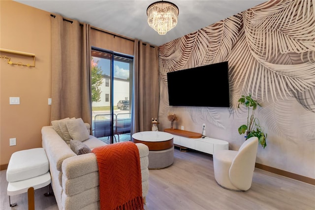 3292 Tranquil Trl, Kissimmee, FL 34747 - living room with wood finished floors, a chandelier, and wallpapered walls