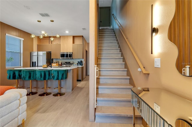 3292 Tranquil Trl, Kissimmee, FL 34747 - staircase featuring wood finished floors