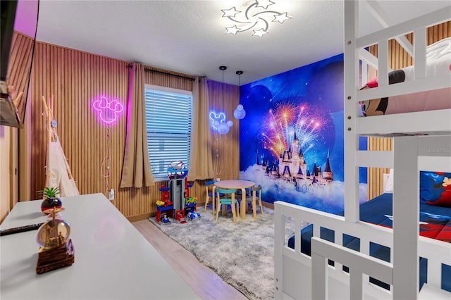 3292 Tranquil Trl, Kissimmee, FL 34747 - playroom with wood finished floors and a textured ceiling