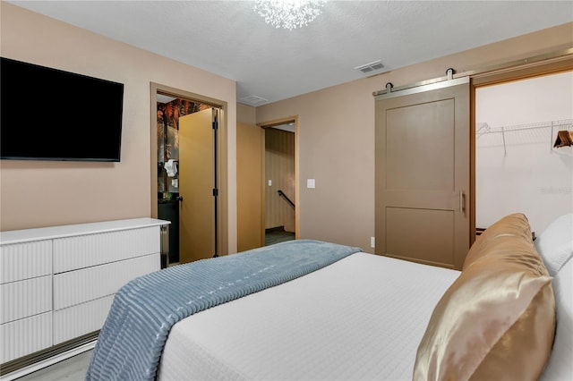3292 Tranquil Trl, Kissimmee, FL 34747 - bedroom featuring a walk in closet and a textured ceiling