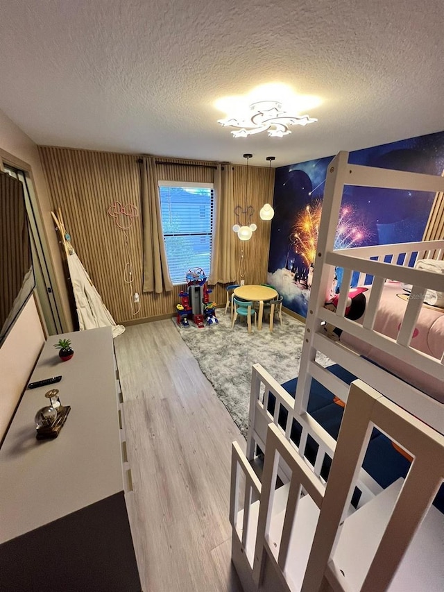 3292 Tranquil Trl, Kissimmee, FL 34747 - rec room featuring a textured ceiling and wood finished floors