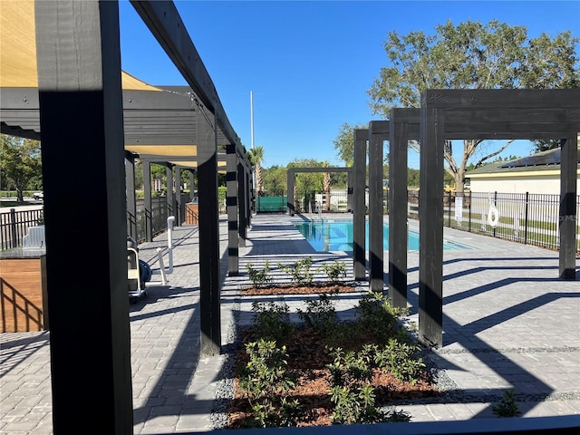 3292 Tranquil Trl, Kissimmee, FL 34747 - view of patio with a community pool and a pergola