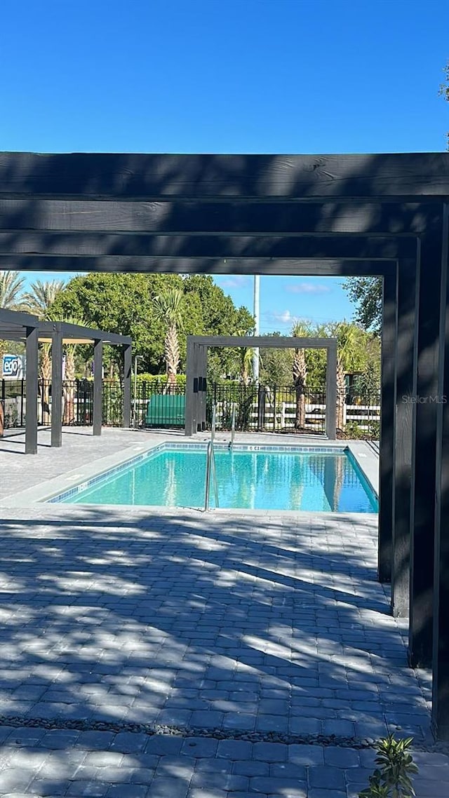 3292 Tranquil Trl, Kissimmee, FL 34747 - community pool with a patio area