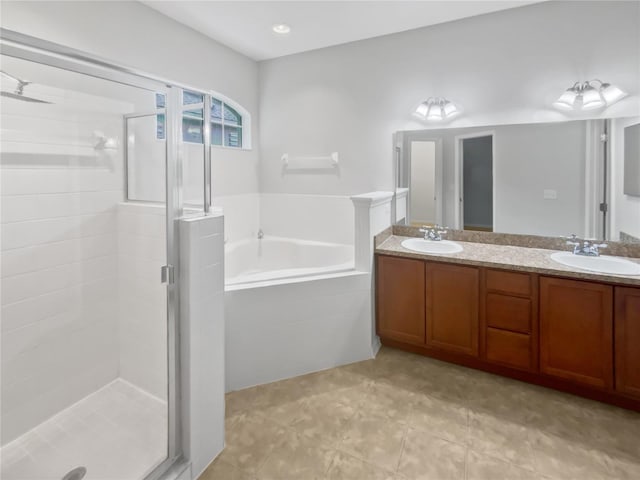 6303 Twin Bridges Dr, Zephyrhills, FL 33541 - bathroom featuring a bath, a shower stall, double vanity, and tile patterned floors