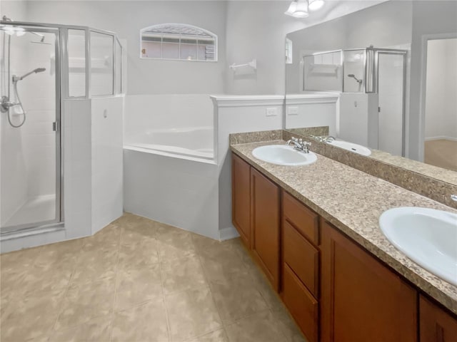 6303 Twin Bridges Dr, Zephyrhills, FL 33541 - bathroom featuring a stall shower, double vanity, a garden tub, and tile patterned flooring