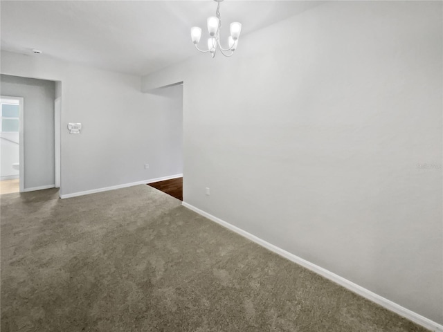 6303 Twin Bridges Dr, Zephyrhills, FL 33541 - empty room featuring a chandelier and carpet flooring