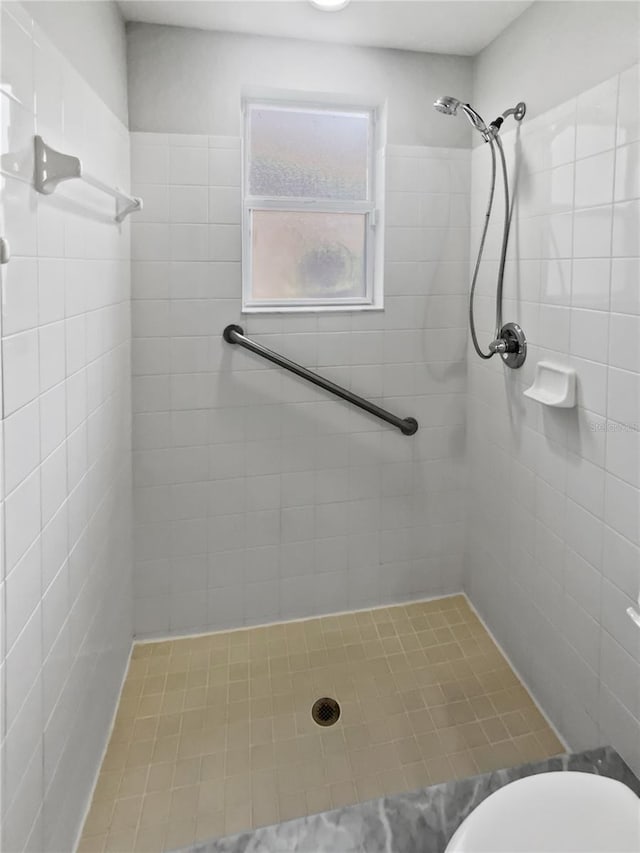 6303 Twin Bridges Dr, Zephyrhills, FL 33541 - full bathroom featuring tiled shower and toilet